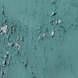 old blue wall with fallen paint